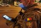 Imaginea zilei vine de la Ploiești: Un militar privește fotografia copilului său într-o pauză de patrulare